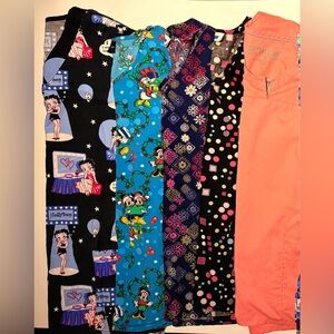 6 Scrubs tops consisting of Disney, Betty Boop& decorative(5 Size medium& l L/XL